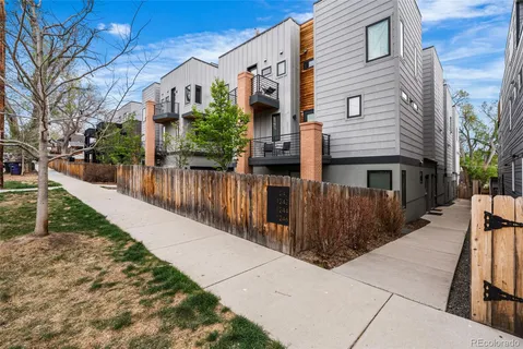 a view of a house with brick walls