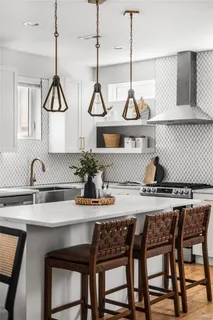 a kitchen with a table and chairs in it
