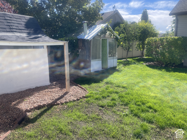 1706 Renaissance Way Springville, UT 84663 - Photo 8 of 31 Greenhouse structure, manicured lawn, established landscaping, privacy fencing