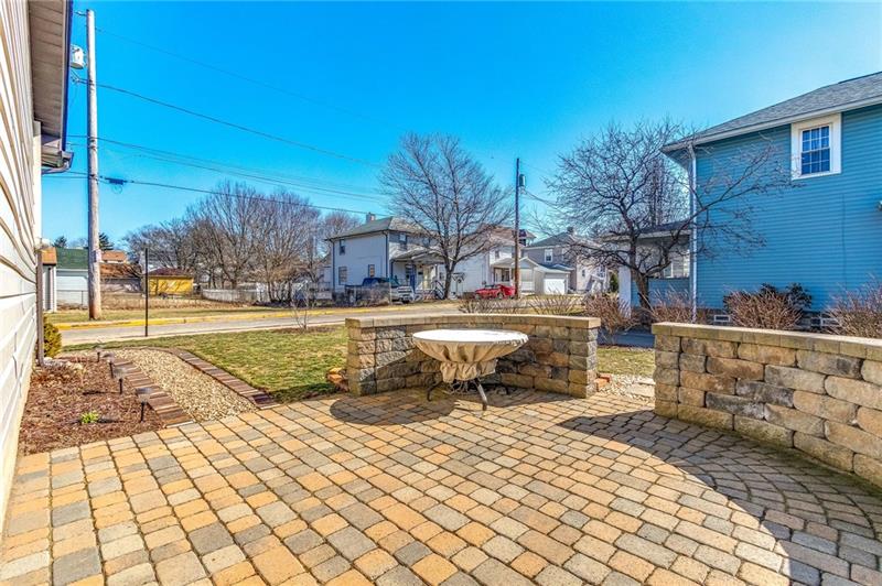 NEW OMNI STONE PATIO TO ENJOY WITH PRIVACY WALL AND BEAUTIFUL WALKWAY TO FRONT!