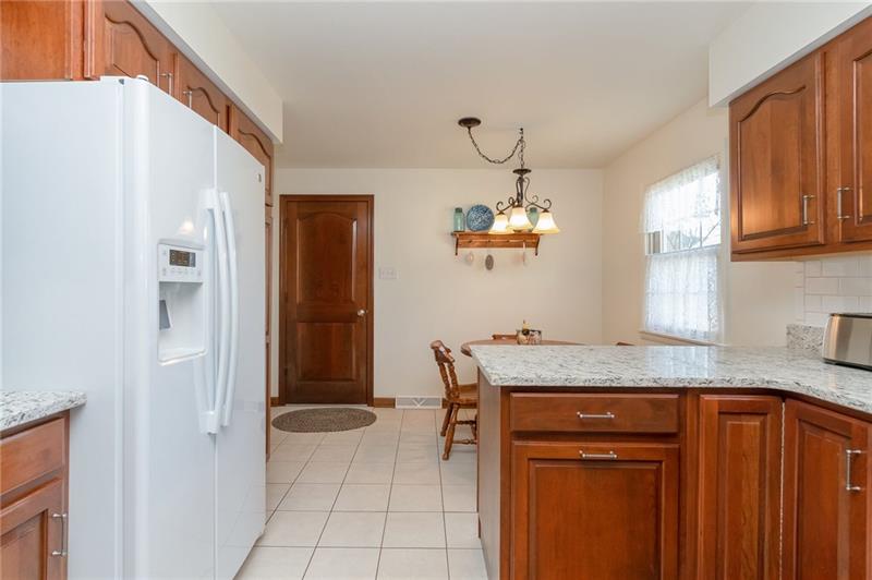 385 Navigation Street Beaver, PA 15009 - Photo 8 of 20 LOVELY KITCHEN WITH GREAT EATING AREA. NEW CERAMIC FLOORS AND GRANITE COUNTERS