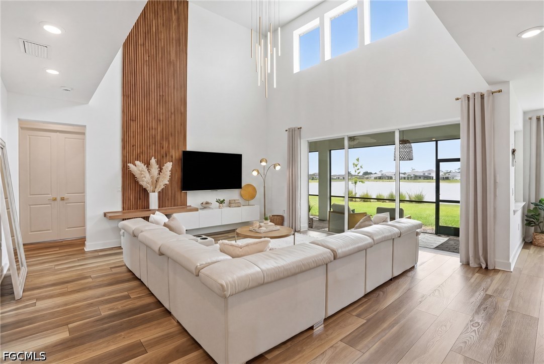 a living room with fireplace furniture and a flat screen tv