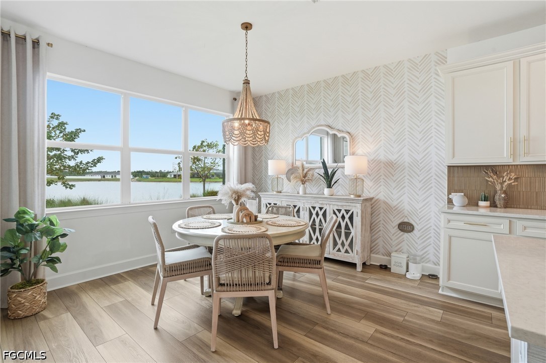 15572 Northridge Road Punta Gorda, FL 33982 - Photo 15 of 48 a view of a dining room with furniture window and wooden floor