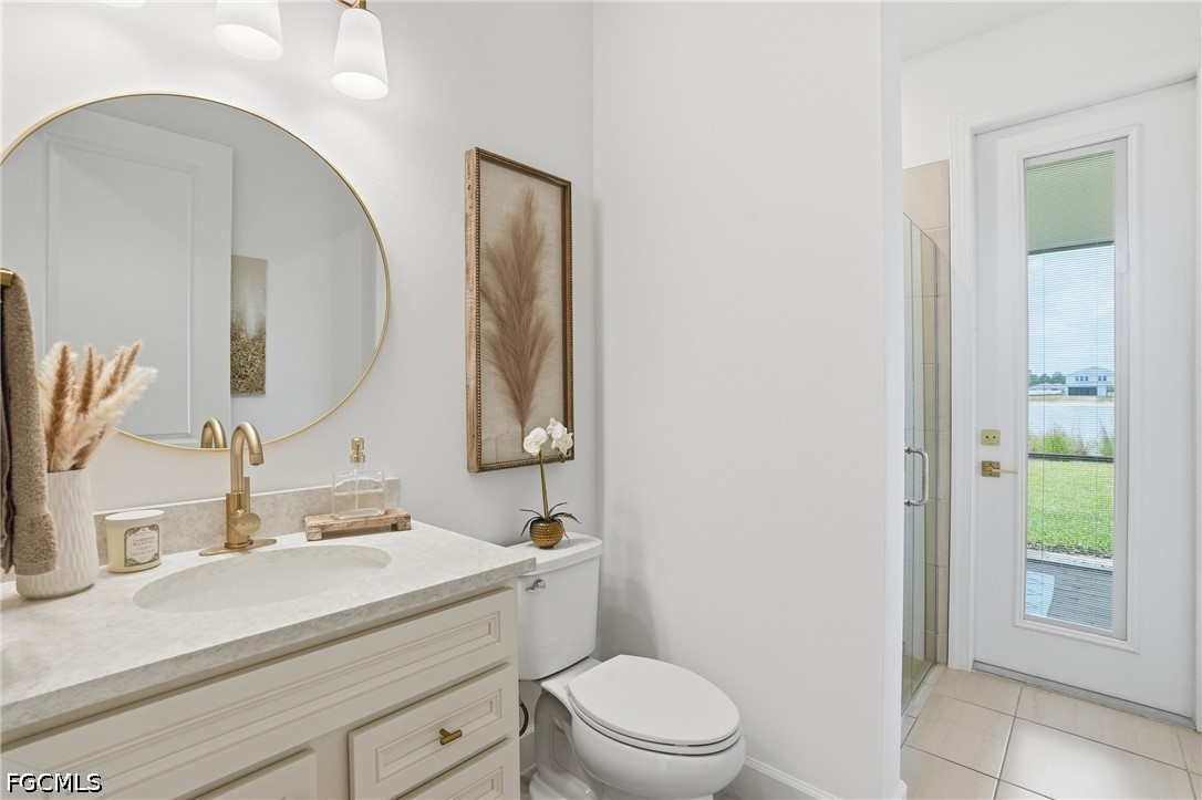 15572 Northridge Road Punta Gorda, FL 33982 - Photo 17 of 48 a bathroom with a sink a toilet and a mirror