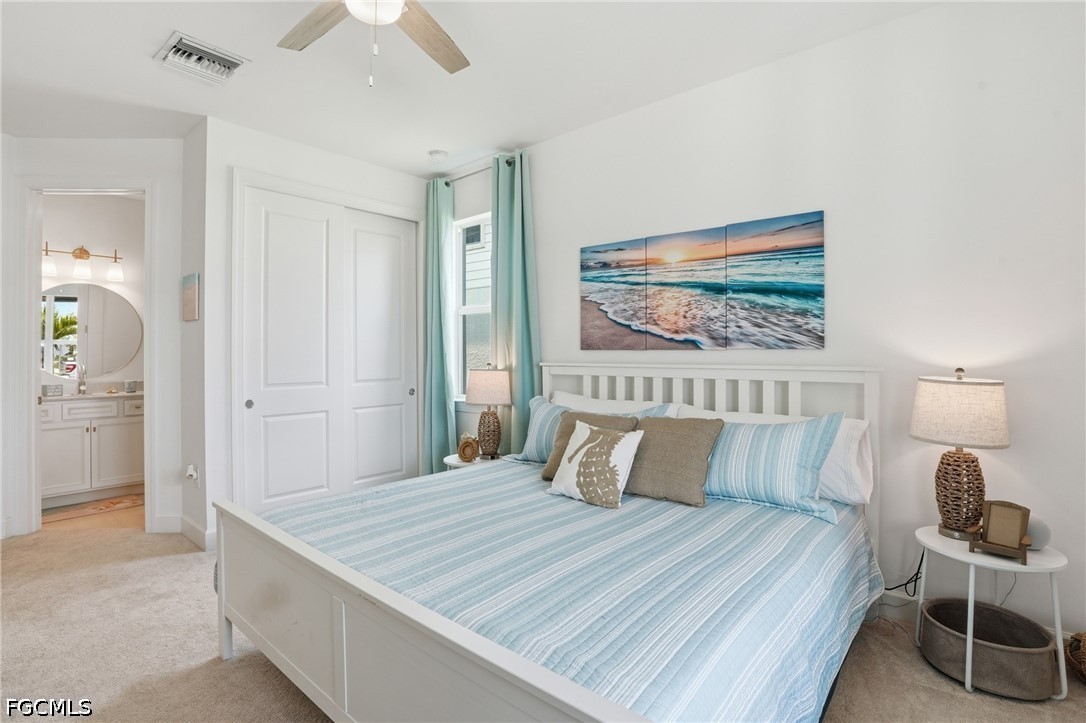 15572 Northridge Road Punta Gorda, FL 33982 - Photo 20 of 48 a bedroom with a bed and a painting on the wall