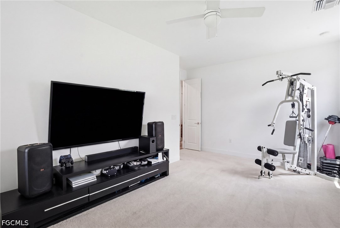 15572 Northridge Road Punta Gorda, FL 33982 - Photo 22 of 48 a room with furniture and flat screen tv