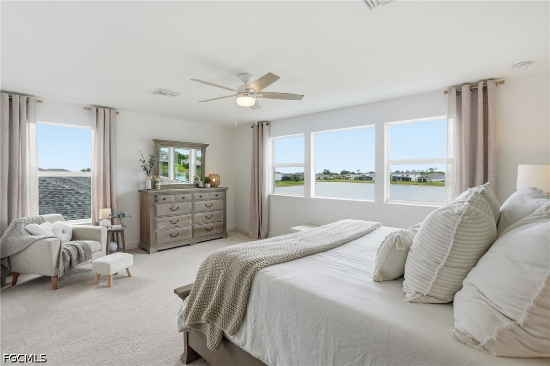 15572 Northridge Road Punta Gorda, FL 33982 - Photo 29 of 48 a bedroom with a large bed and a large window