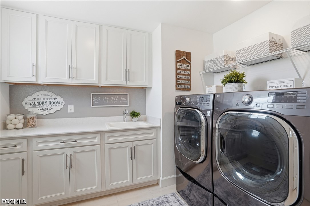 15572 Northridge Road Punta Gorda, FL 33982 - Photo 35 of 48 a utility room with sink dryer and washer