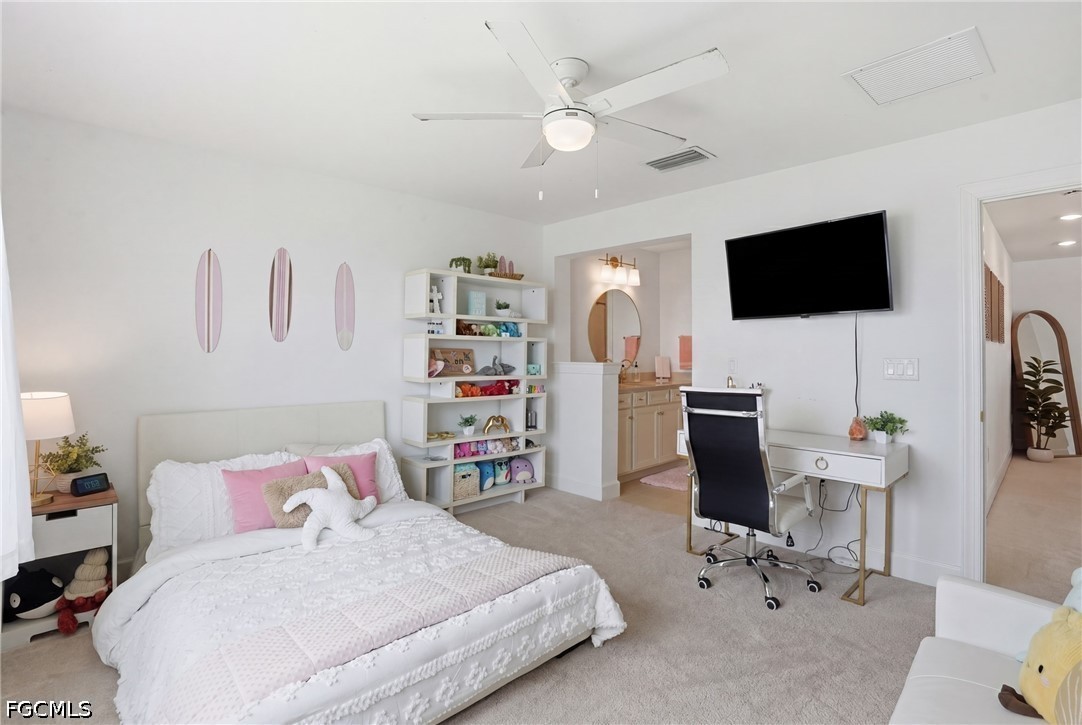 15572 Northridge Road Punta Gorda, FL 33982 - Photo 36 of 48 a bedroom with a bed and a flat screen tv