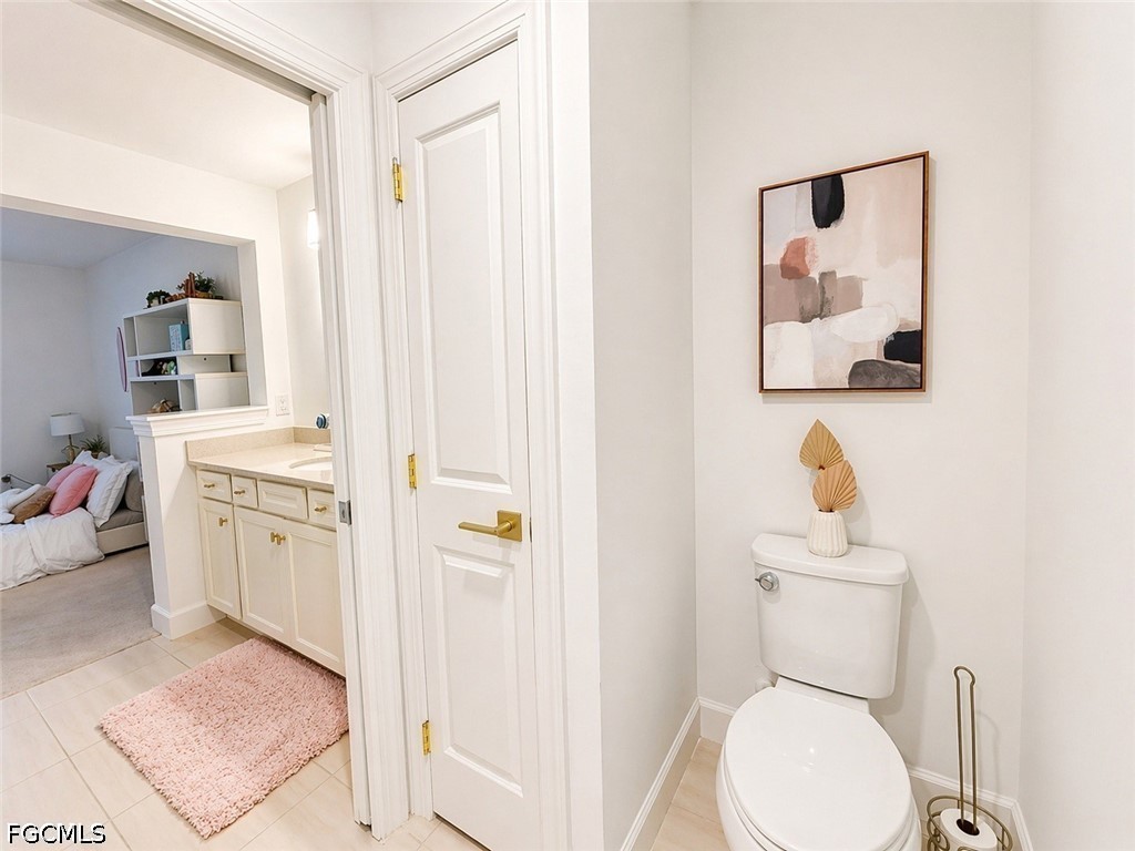 15572 Northridge Road Punta Gorda, FL 33982 - Photo 37 of 48 a white toilet sitting next to a bathroom sink