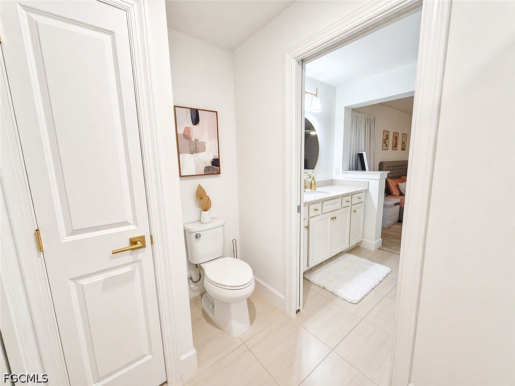 15572 Northridge Road Punta Gorda, FL 33982 - Photo 38 of 48 a bathroom with a toilet sink and mirror