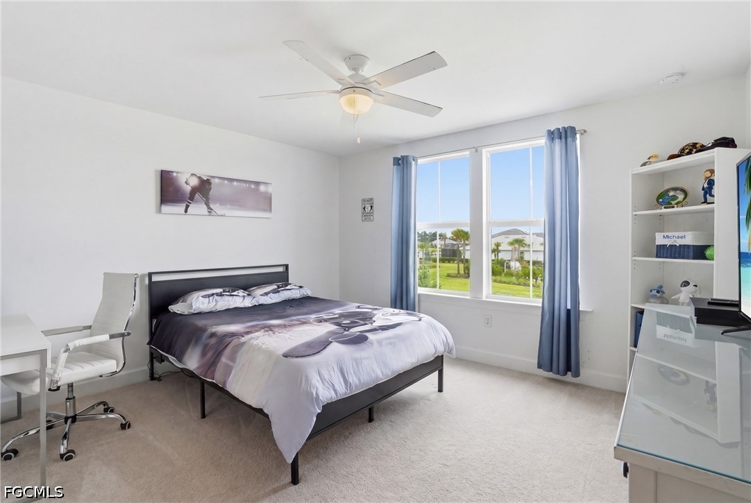 15572 Northridge Road Punta Gorda, FL 33982 - Photo 40 of 48 a bed sitting in a spacious bedroom next to a window