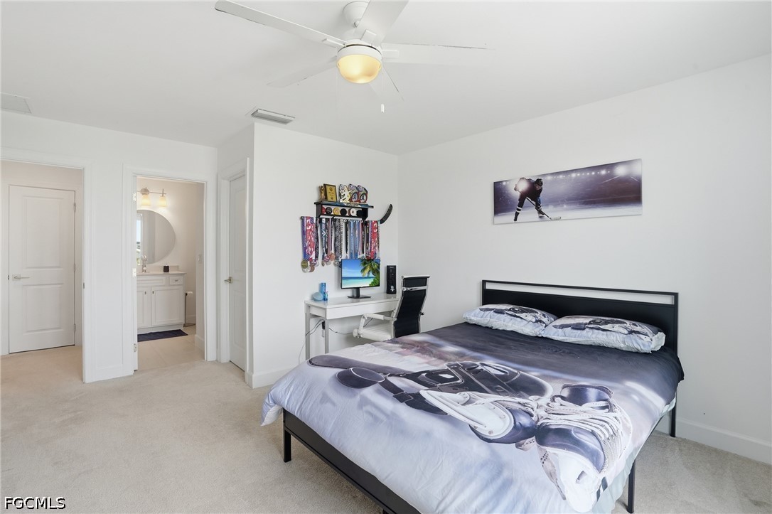 15572 Northridge Road Punta Gorda, FL 33982 - Photo 41 of 48 a bedroom with a bed and a book shelf