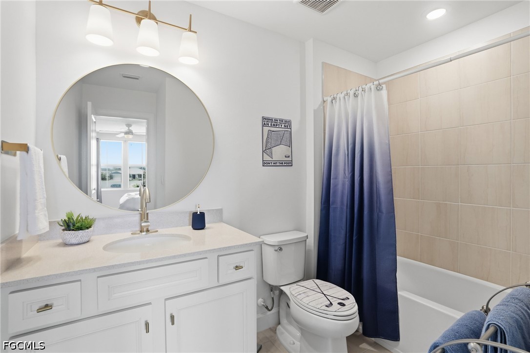 15572 Northridge Road Punta Gorda, FL 33982 - Photo 42 of 48 a bathroom with a toilet a sink and a mirror