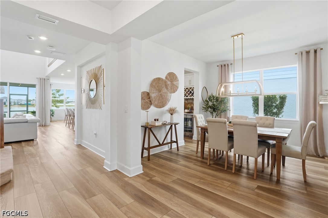 15572 Northridge Road Punta Gorda, FL 33982 - Photo 7 of 48 a view of a dining room with furniture window and wooden floor