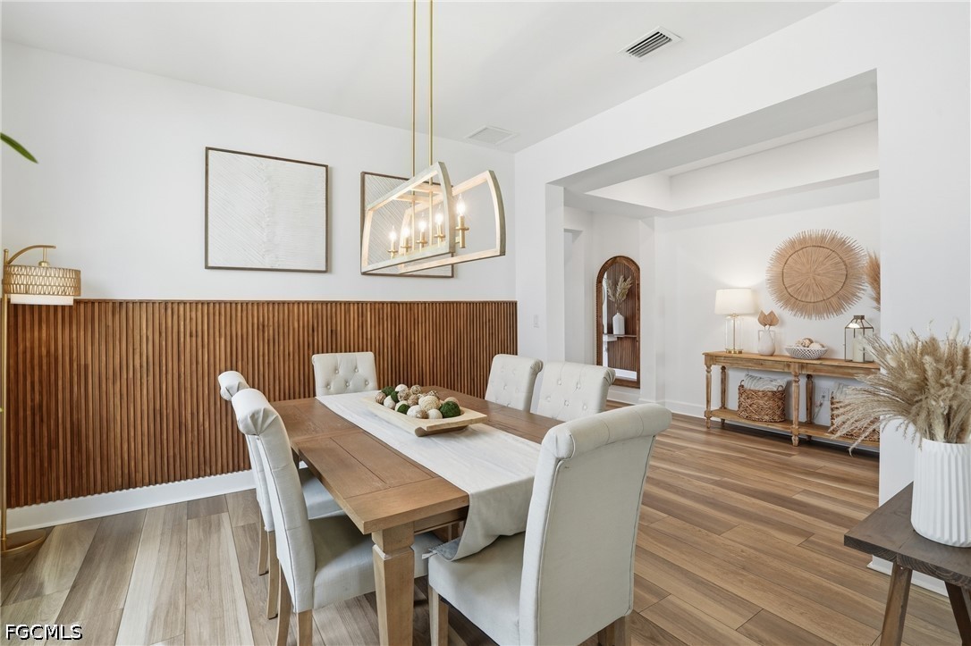 15572 Northridge Road Punta Gorda, FL 33982 - Photo 9 of 48 a view of a dining room with furniture window and wooden floor