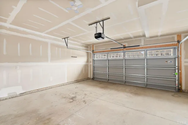 a living room with furniture and a view of entryway