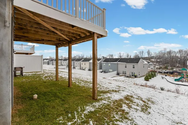 a view of a backyard with sitting area