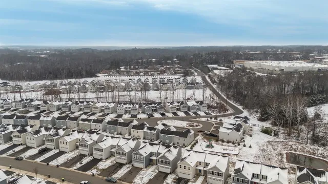 an aerial view of a city with lots of residential buildings