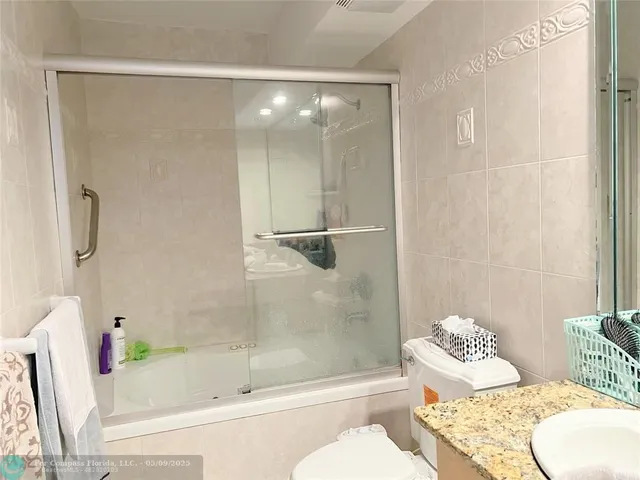 a bathroom with a sink and a shower