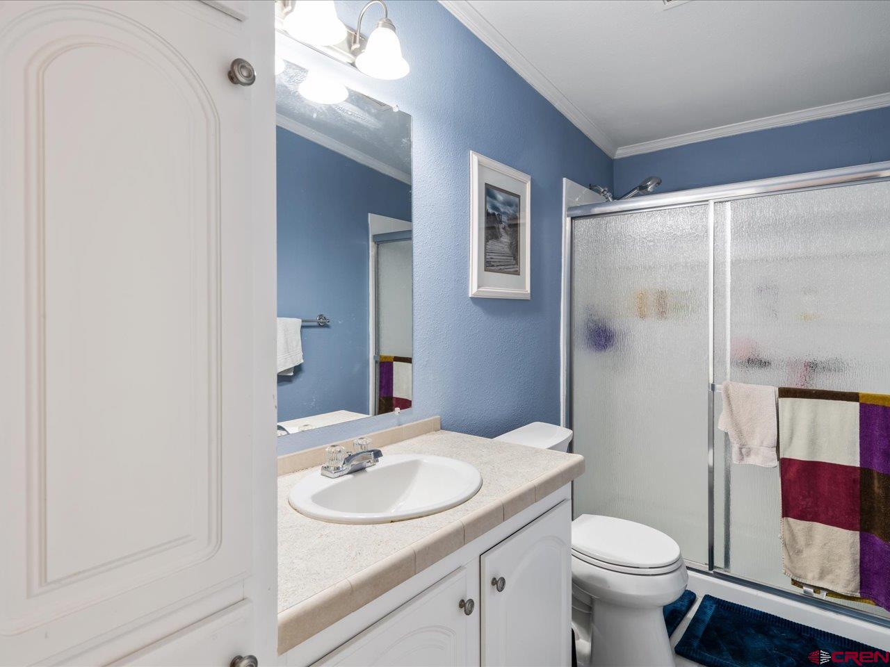 1857 Sego Lane Delta, CO 81416 - Photo 14 of 34 a bathroom with a sink toilet and shower