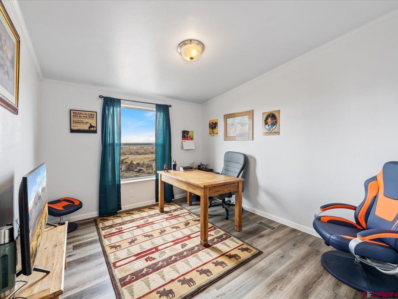 1857 Sego Lane Delta, CO 81416 - Photo 15 of 34 a living room with furniture a rug and a table