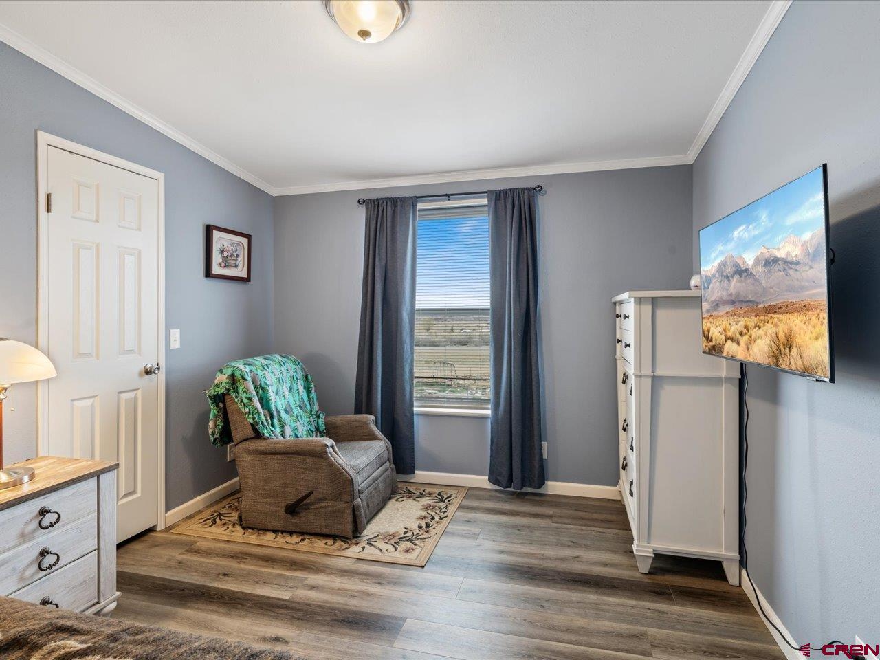 1857 Sego Lane Delta, CO 81416 - Photo 16 of 34 a living room with furniture and a flat screen tv