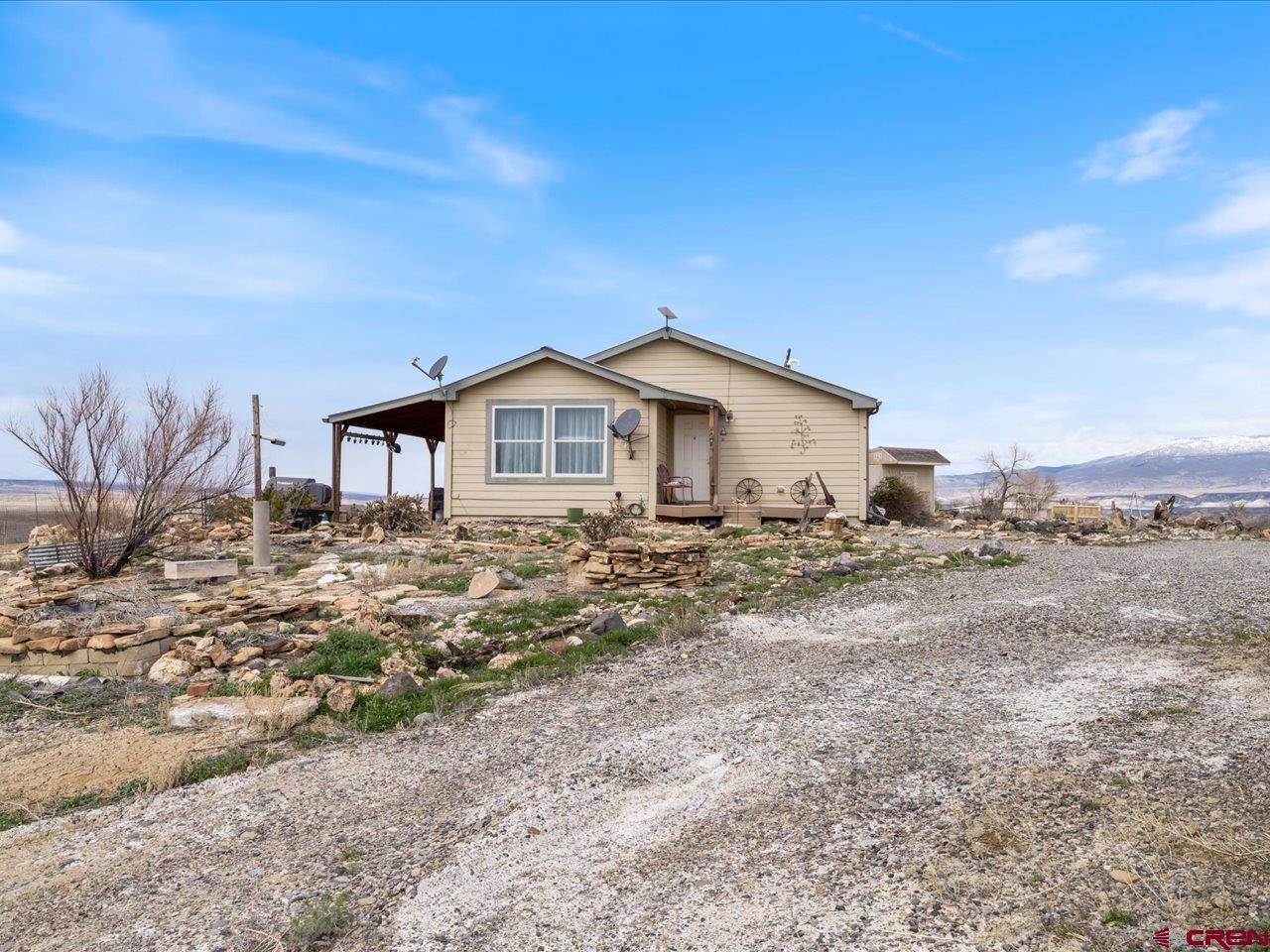 1857 Sego Lane Delta, CO 81416 - Photo 25 of 34 a view of a house with a yard