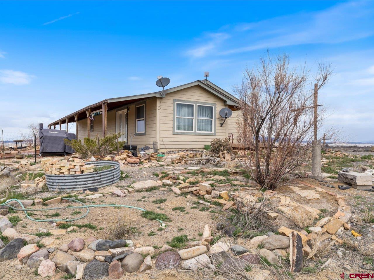 1857 Sego Lane Delta, CO 81416 - Photo 26 of 34 a front view of a house with garden