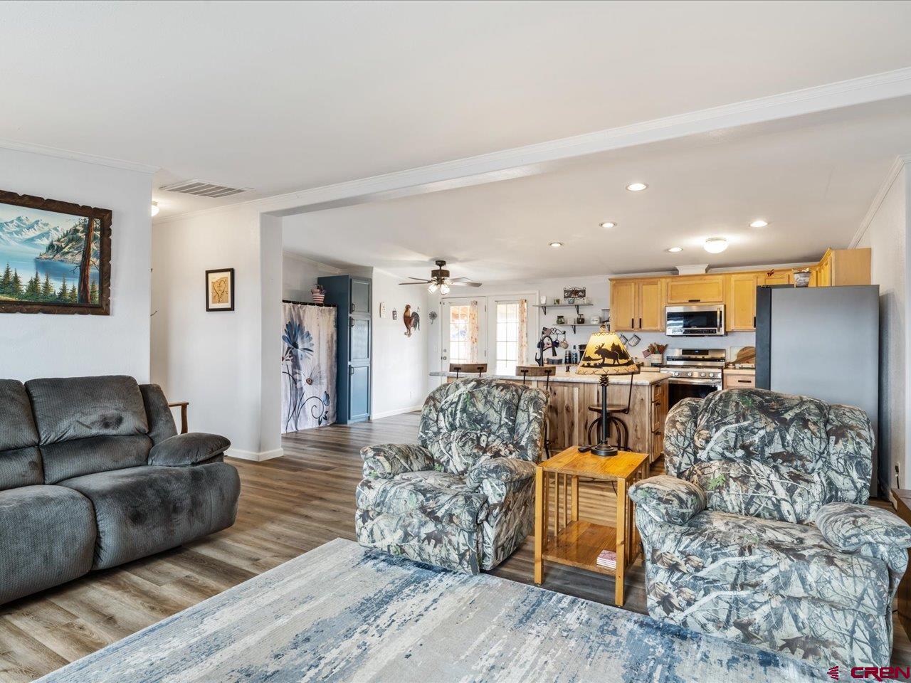 1857 Sego Lane Delta, CO 81416 - Photo 7 of 34 a living room with furniture and a view of kitchen