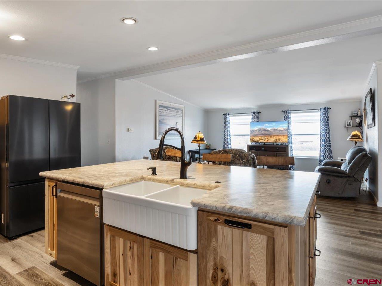 1857 Sego Lane Delta, CO 81416 - Photo 9 of 34 a kitchen with granite countertop a sink a counter top space and stainless steel appliances
