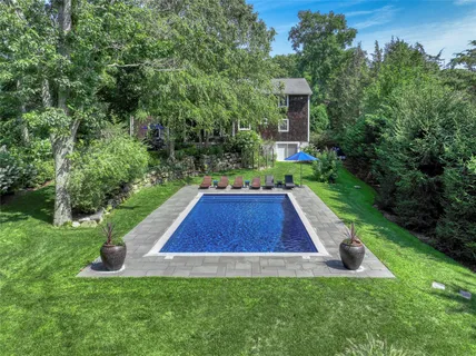 a view of an house with backyard space and garden