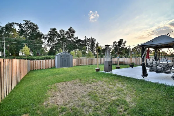 a view of a backyard with green space