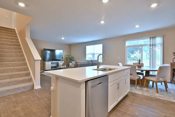 a kitchen with sink and cabinets