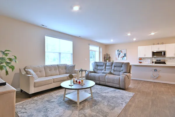 a living room with furniture and a large window