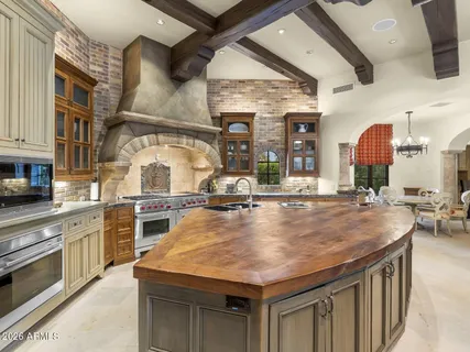 a room with dining table and chairs