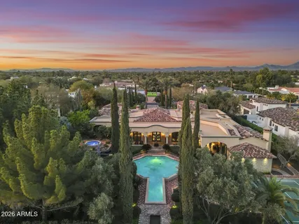 an aerial view of residential house with outdoor space and parking