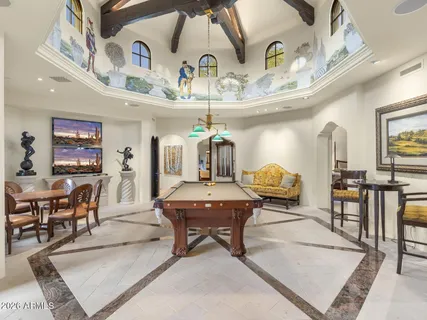 a living room with furniture and a table