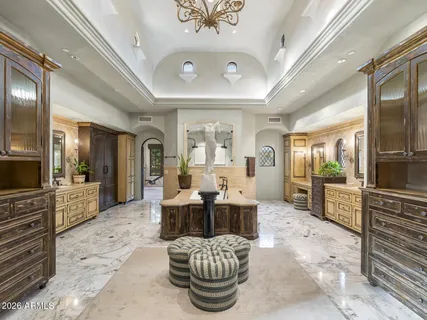 a view of a patio with table and chairs with wooden floor and fence