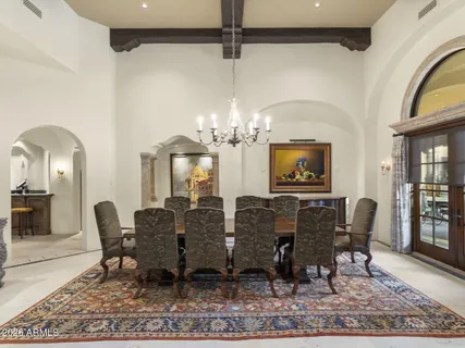 a kitchen with stainless steel appliances granite countertop a stove a sink dishwasher and cabinets with wooden floor