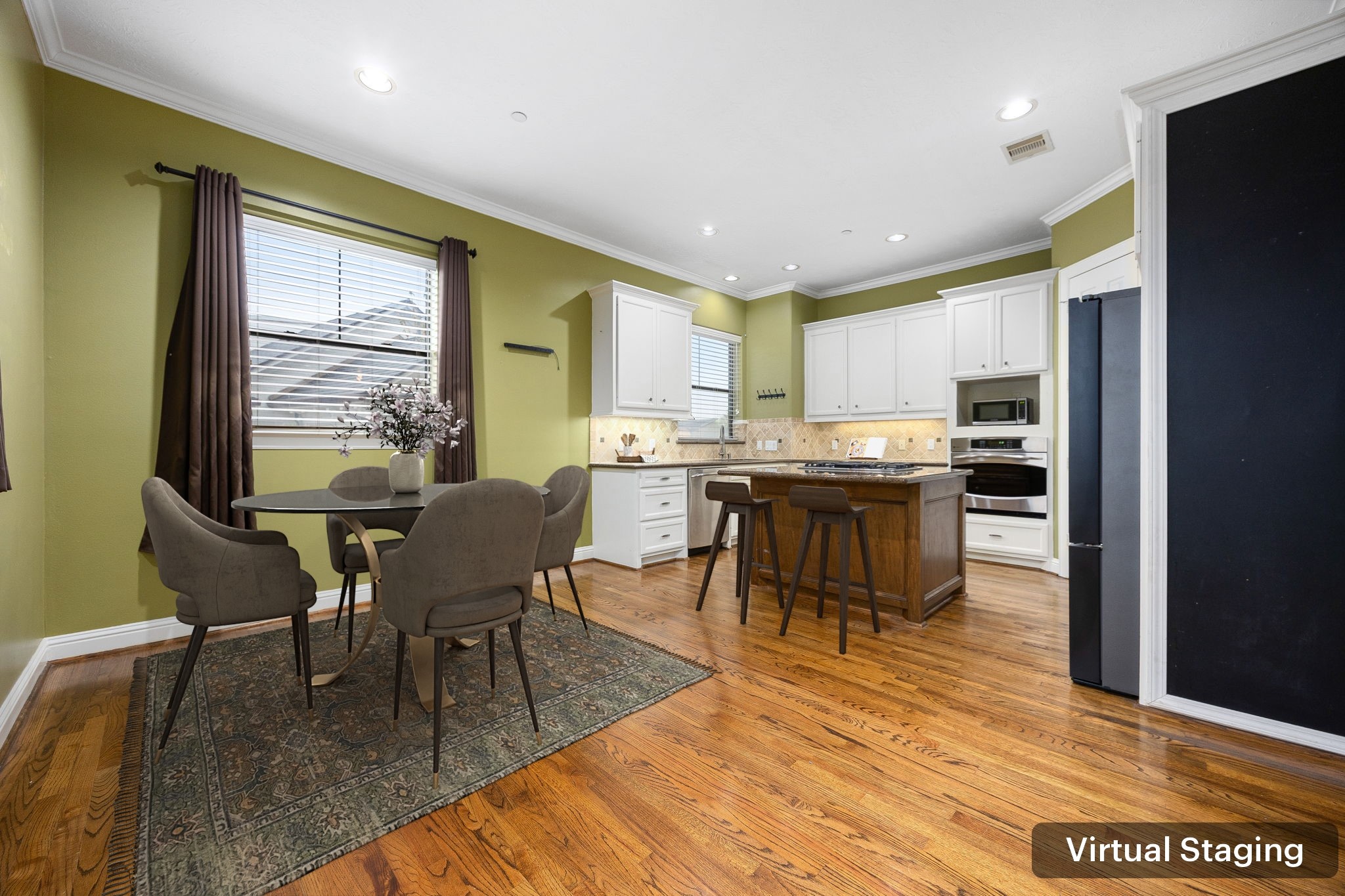 2611 Riverside Drive, Unit D Houston, TX 77004 - Photo 13 of 50 a open kitchen with stainless steel appliances granite countertop a stove top oven a sink a dining table and chairs with wooden floor