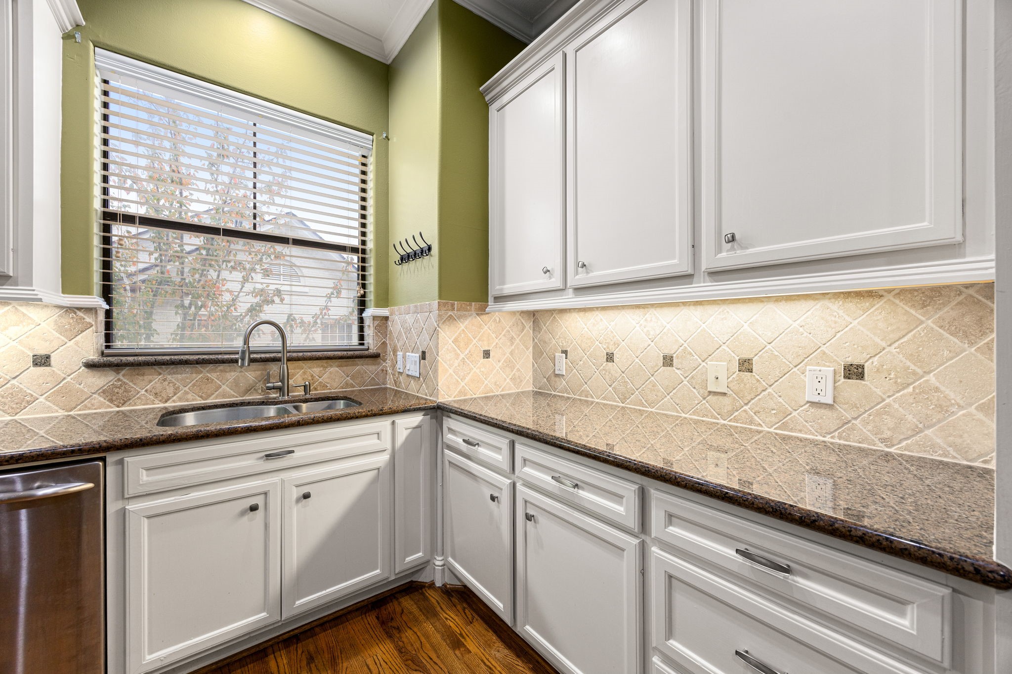 2611 Riverside Drive, Unit D Houston, TX 77004 - Photo 15 of 50 a kitchen with granite countertop white cabinets and a window