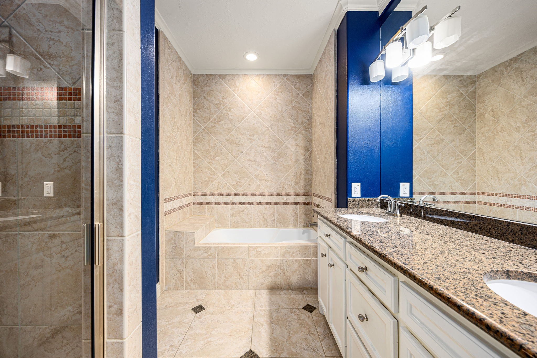 2611 Riverside Drive, Unit D Houston, TX 77004 - Photo 23 of 50 a bathroom with a granite countertop bathtub shower sink and mirror