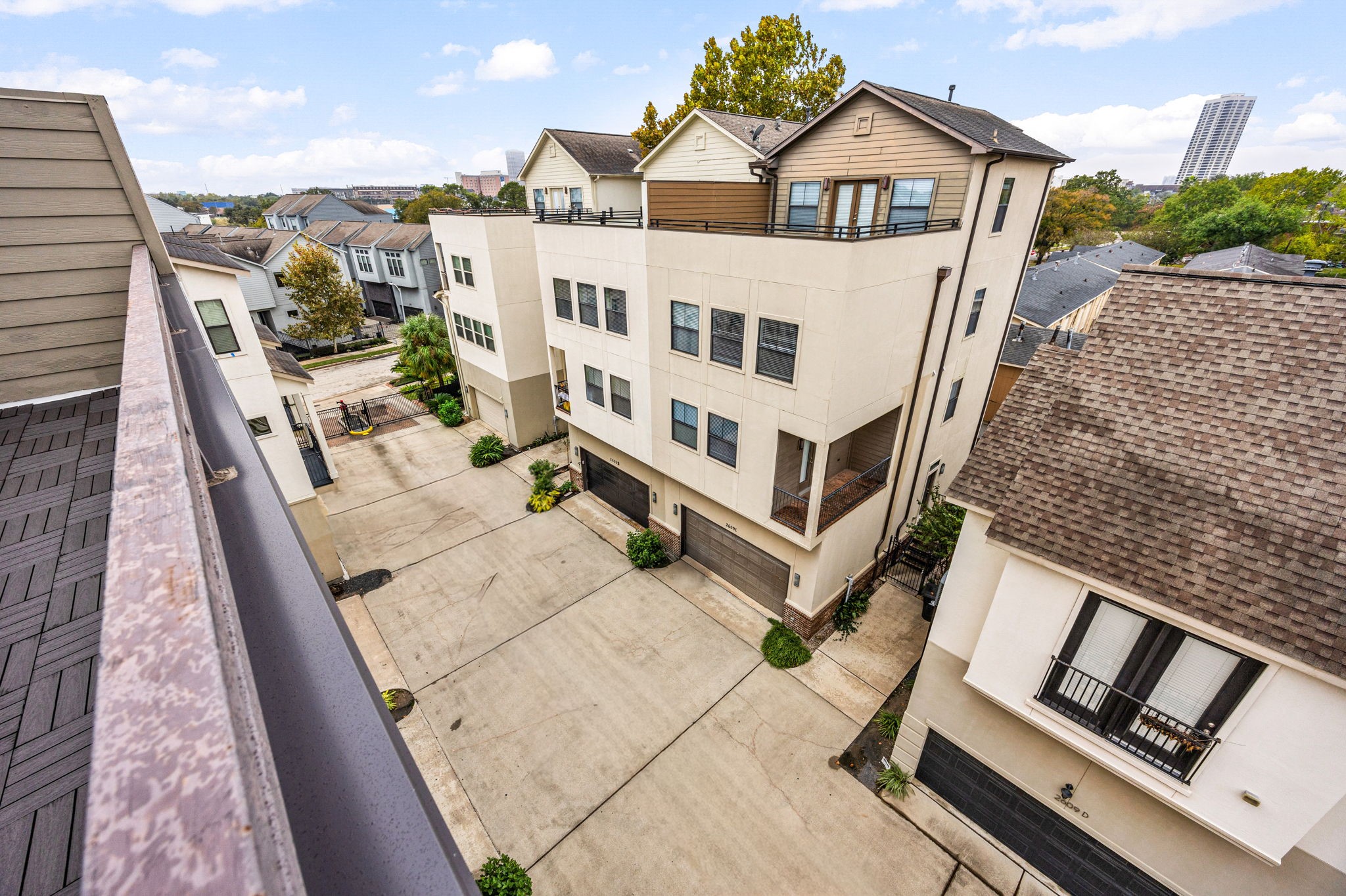 2611 Riverside Drive, Unit D Houston, TX 77004 - Photo 30 of 50 a view of a balcony with couches and wooden floor