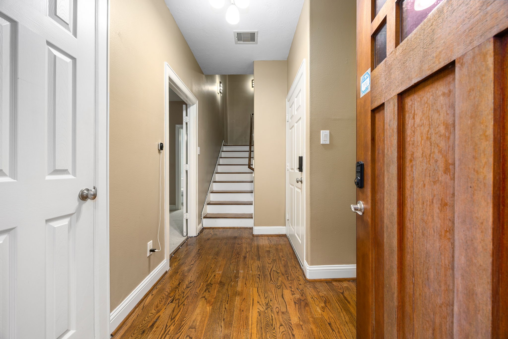 2611 Riverside Drive, Unit D Houston, TX 77004 - Photo 5 of 50 a view of a hallway with wooden floor and staircase