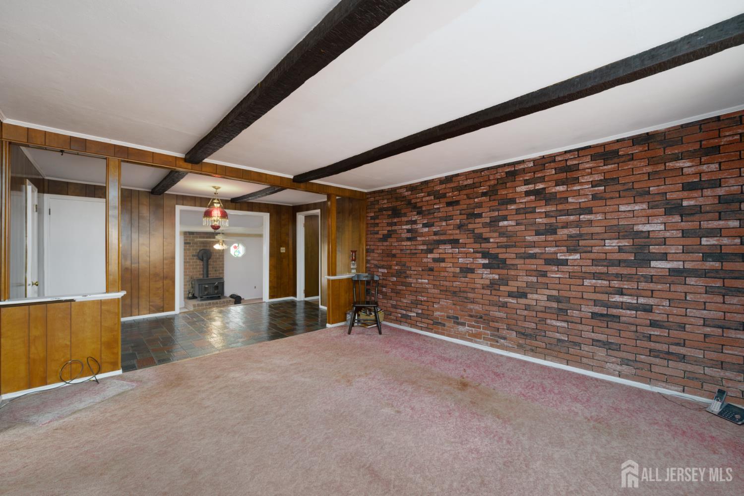 110 Sheppard Place Fords, NJ 08863 - Photo 11 of 34 a view of an empty room with wooden floor