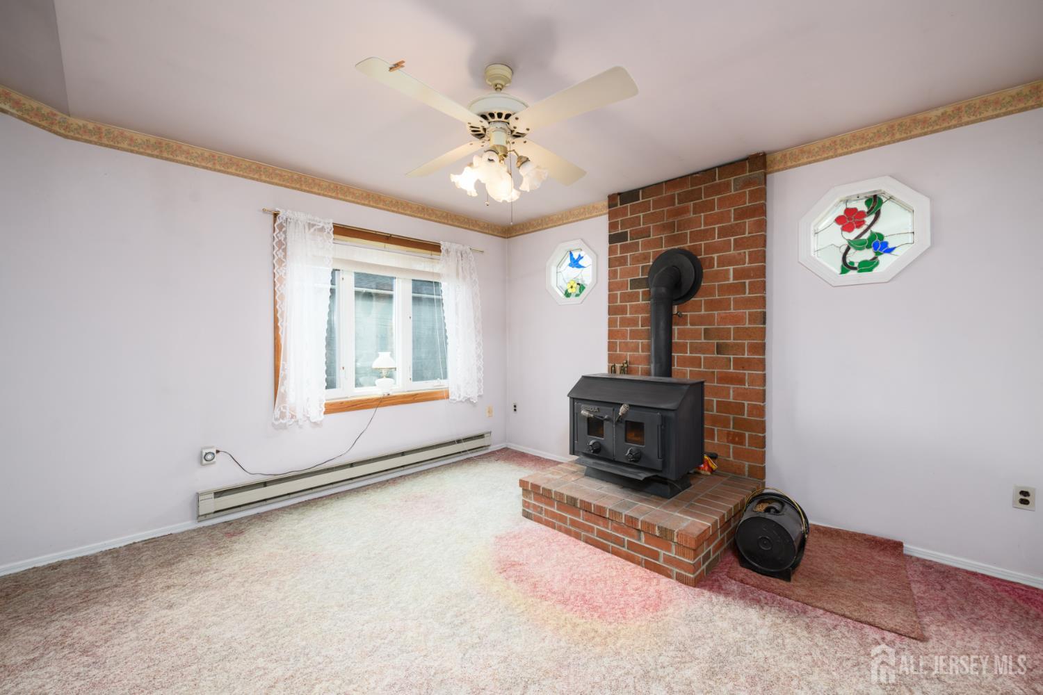 110 Sheppard Place Fords, NJ 08863 - Photo 15 of 34 a living room with furniture and a fireplace