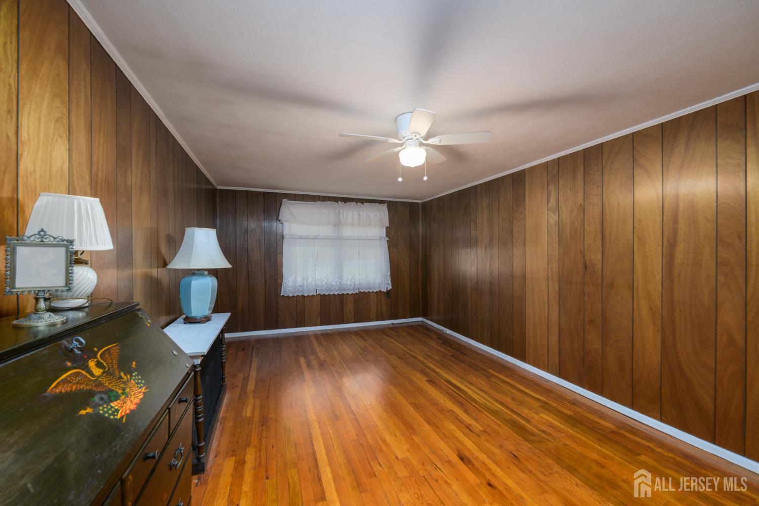 110 Sheppard Place Fords, NJ 08863 - Photo 18 of 34 wooden floor in an empty room with a window