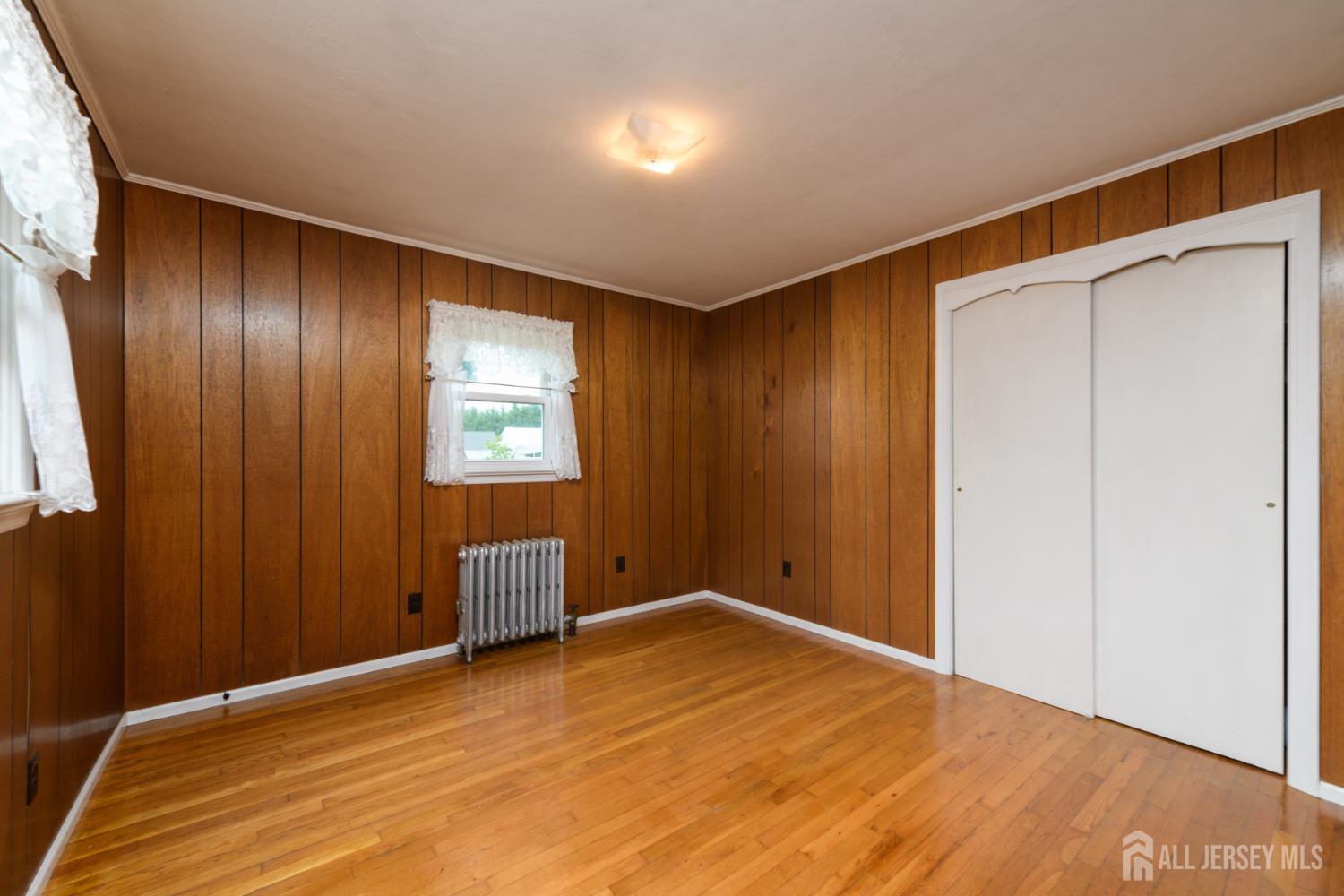 110 Sheppard Place Fords, NJ 08863 - Photo 19 of 34 a view of an empty room and wooden floor
