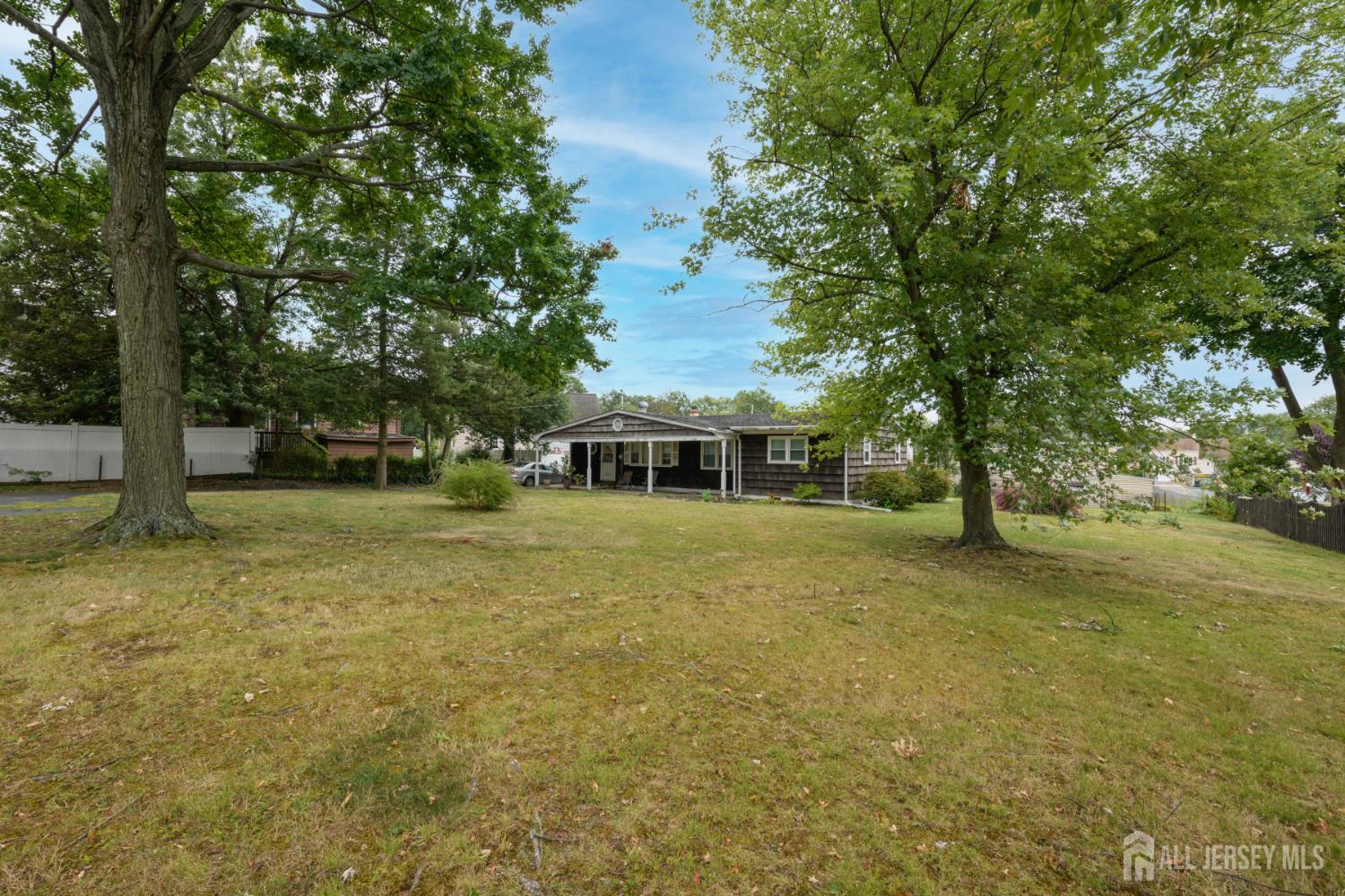 110 Sheppard Place Fords, NJ 08863 - Photo 24 of 34 a front view of a house with a garden
